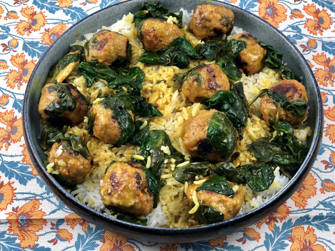 Thai turkey meatballs over rice in a large bowl